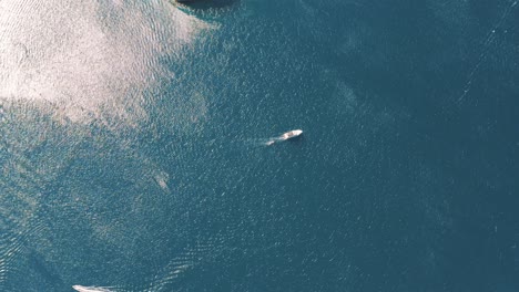 Aerial-drone-flying-over-the-mediterranean-sea-with-sailing-boats,-yachts-in-the-bay-lagoon