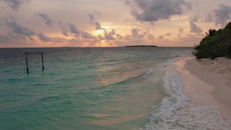 maldives sunset and swing in ocean, panoramic sky and beach