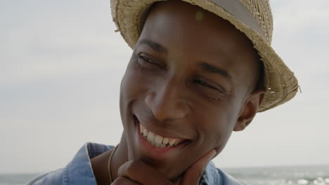 close-up of african american man smiling on the beach 4k