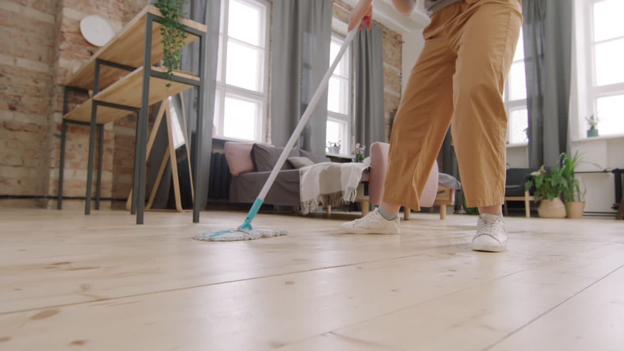 Legs of Woman Mopping Floor and Dancing