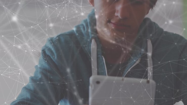 Animation of network of connections over caucasian boy using digital tablet at school