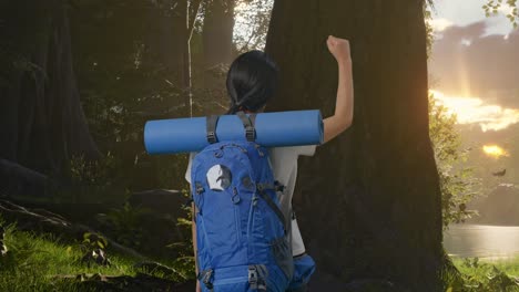 woman hiking in the forest at sunrise