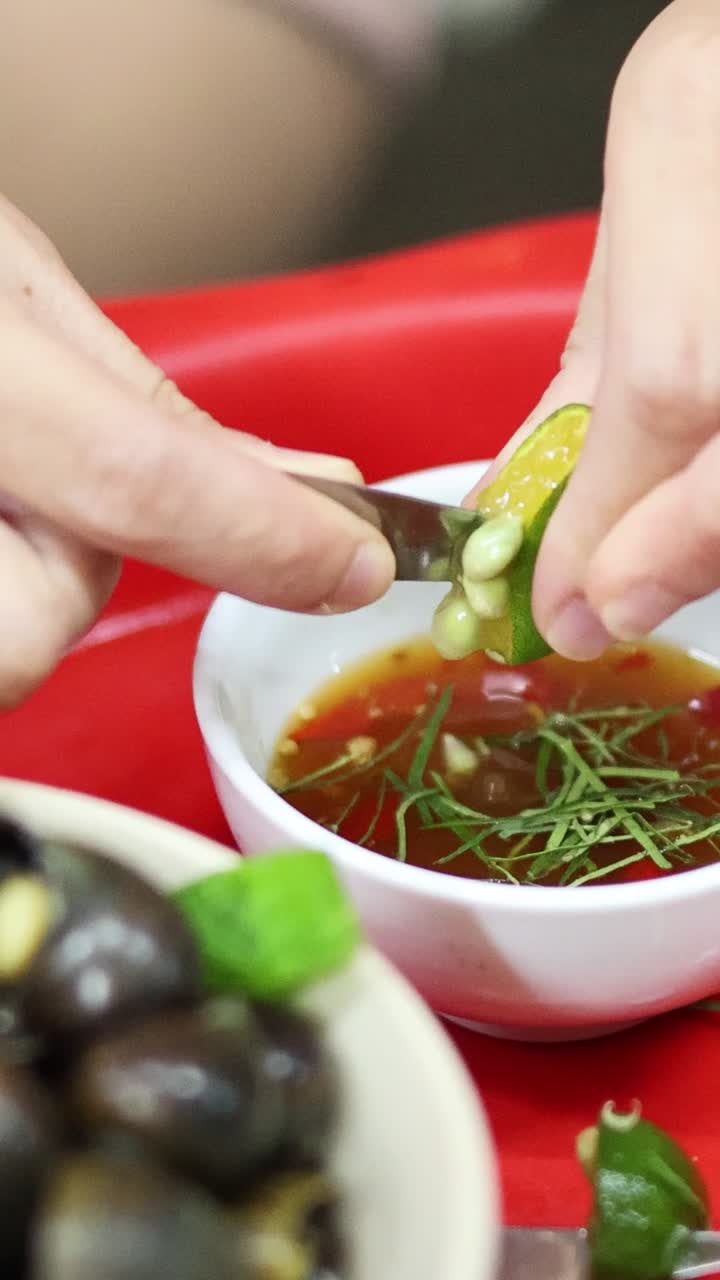 Adding lemon juice to enhance a dipping sauce