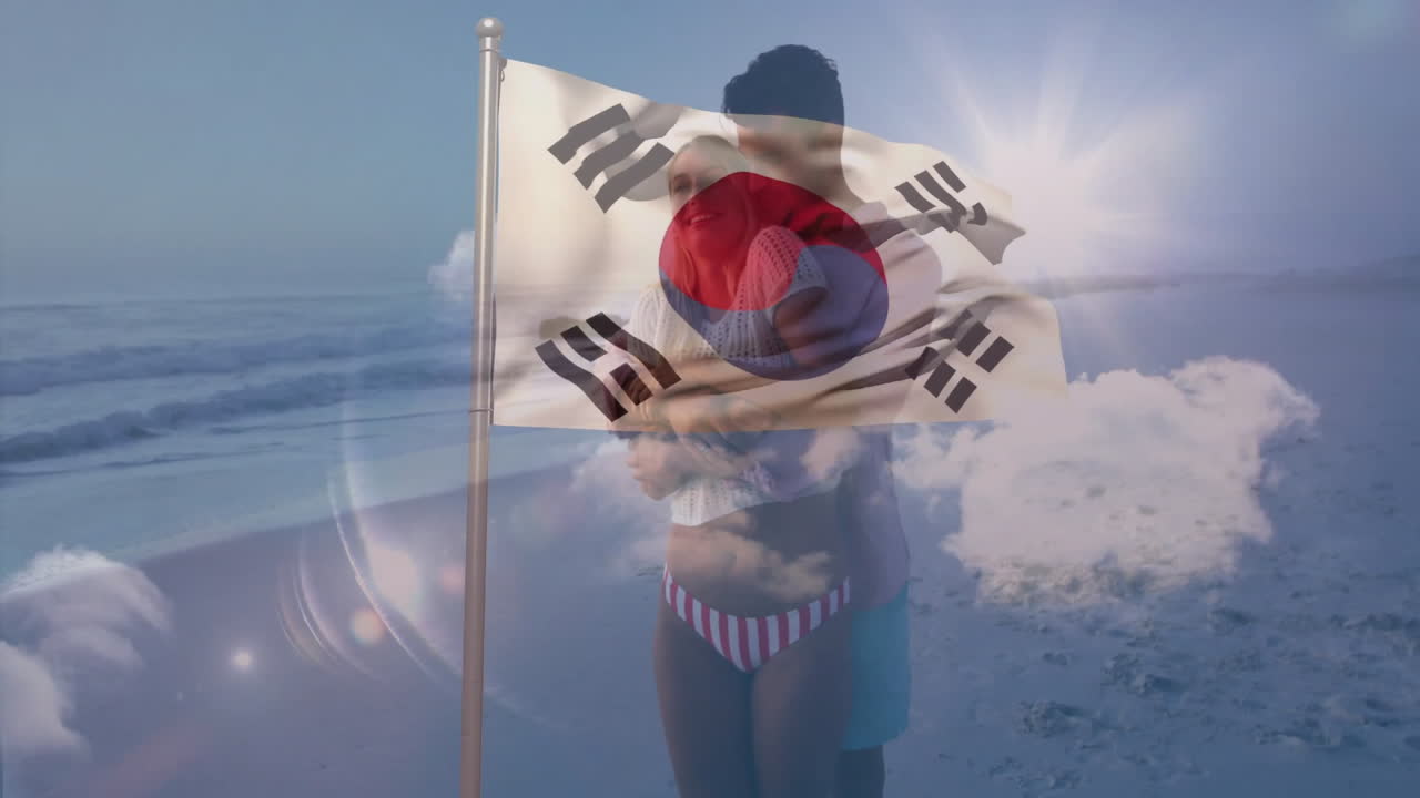 Waving South Korean flag over couple embracing on sunny beach, creating animation