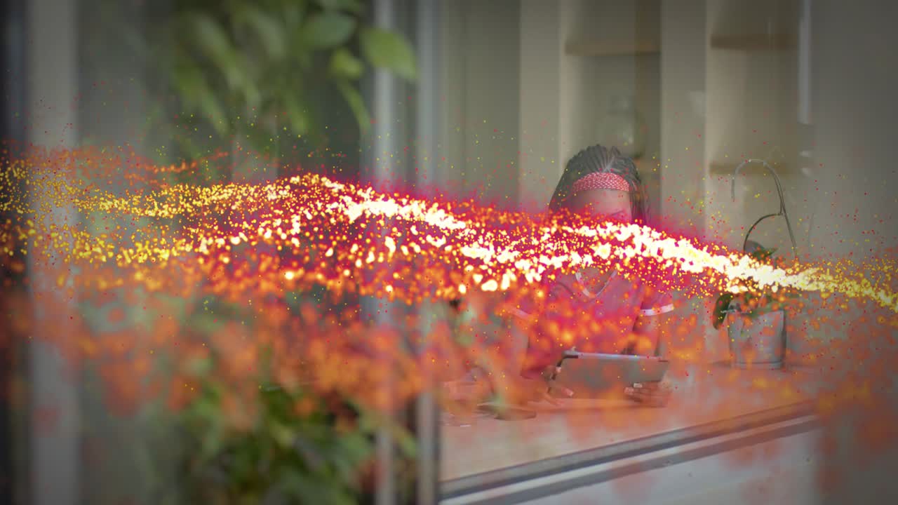 Woman at window holding tablet, red particle band sweeping across and causing tablet tap for tech