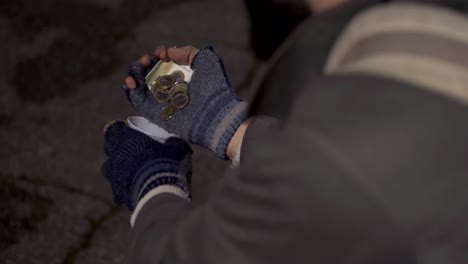 daily alms- homeless hands counting money