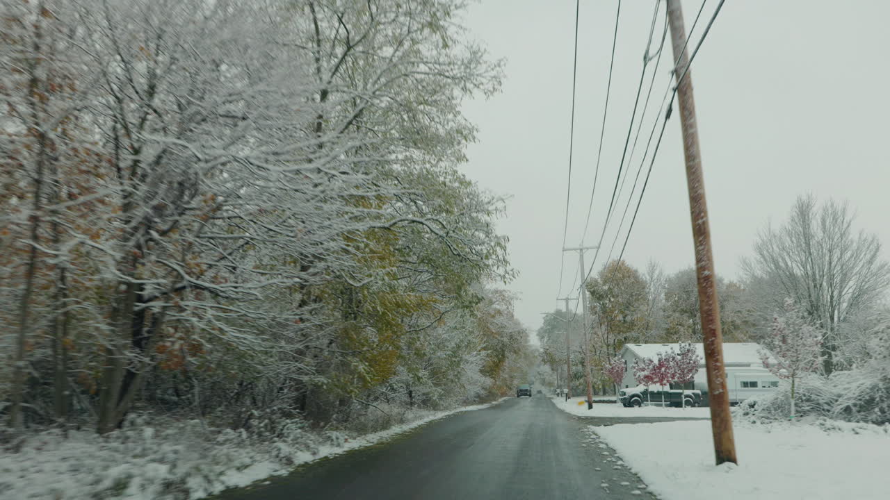 Snowy Road in a Neighborhood
