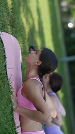 women practicing yoga outdoors