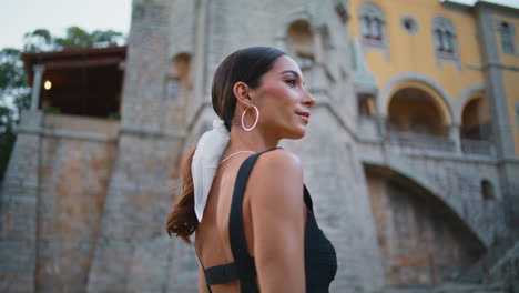 woman in front of a beautiful castle