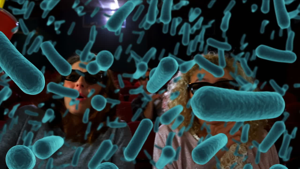 영화관에서 사람들을 상대로 코로나 19 세포의 애니메이션