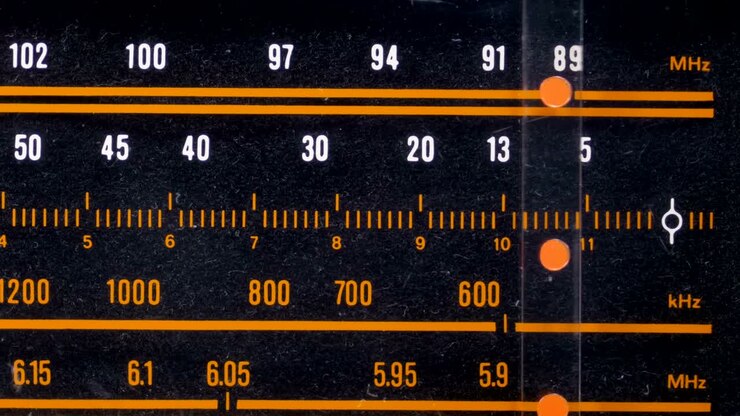 Tuning Analog Radio Dial Frequency on Scale of the Vintage Receiver