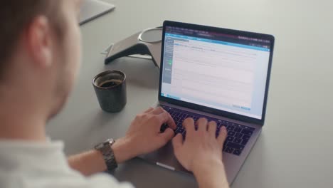 man writing a email in the office