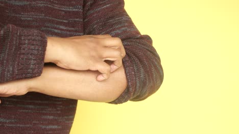person scratching arm