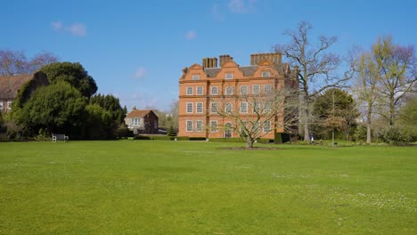 historic red brick house in a park