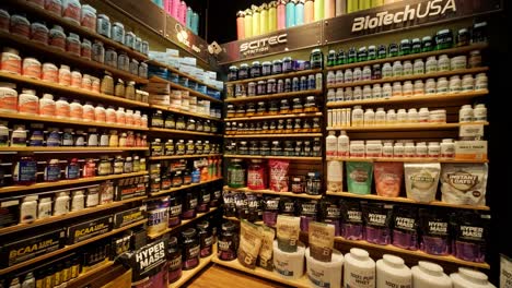 sport nutrition store interior with large choice of nutritional supplements.