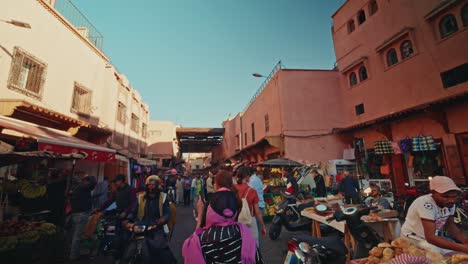 walking through the souks markets in the medina old town in marrakesh, morocco.