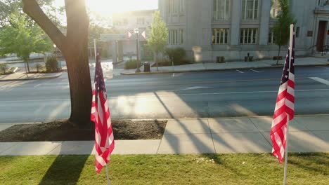 establishing shot, american patriotism in small town america, peaceful calm turn reveals usa flags