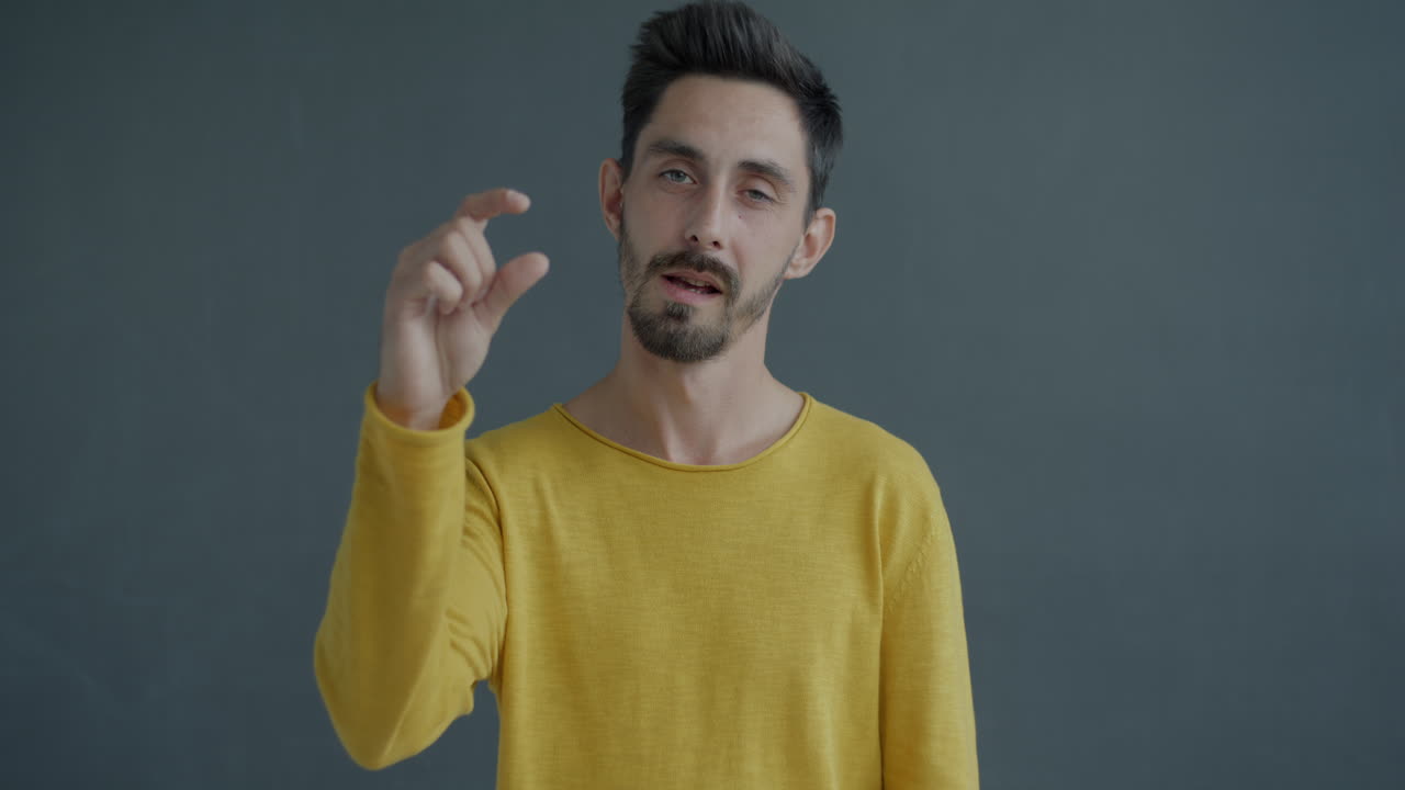 Man Making a Small Gesture