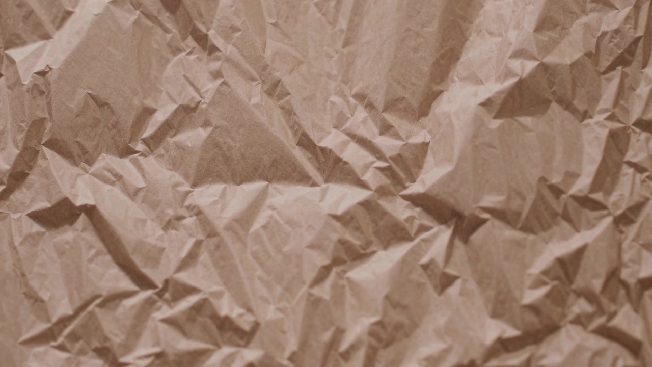 Close-up of Crumpled Brown Paper Texture Background