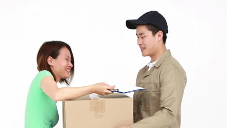 happy delivery man delivering cardboard box