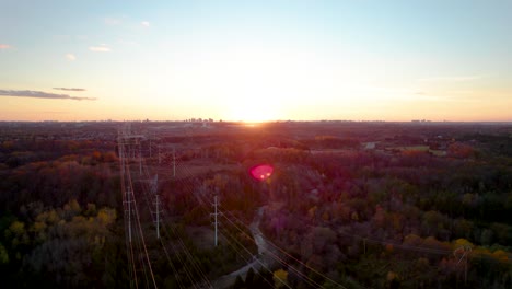 hydro electric power lines scenic fall landscape in rouge river urban park at sunset