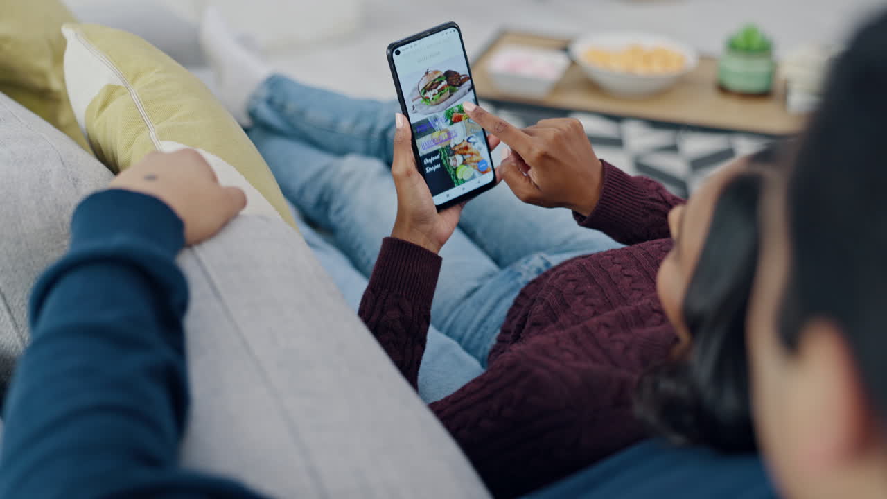 Phone screen, hands and couple with food delivery