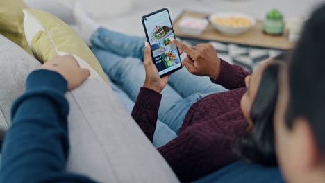 Phone-screen,-hands-and-couple-with-food-delivery