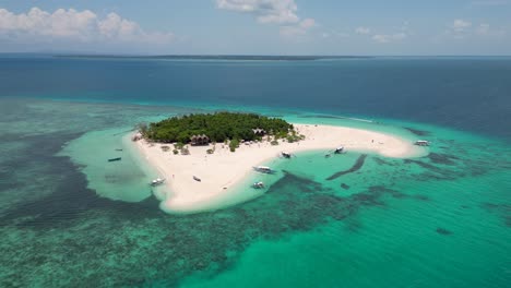 patawan island on perfect clear blue sky and open ocean with idyllic white sandy beach