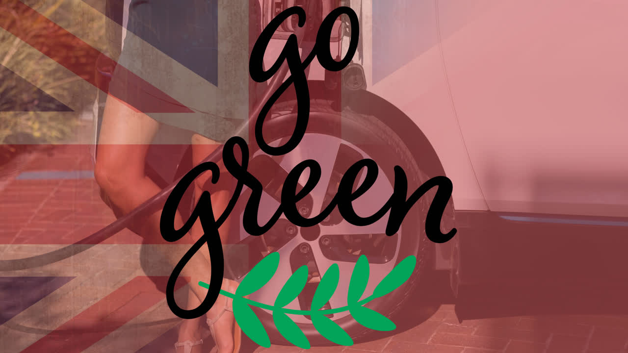 영국 국기 위에 초록색 텍스트와 전기 자동차를 충전하는 사람