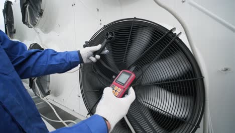 testing with an anemometer of an axial fan of the condensing unit