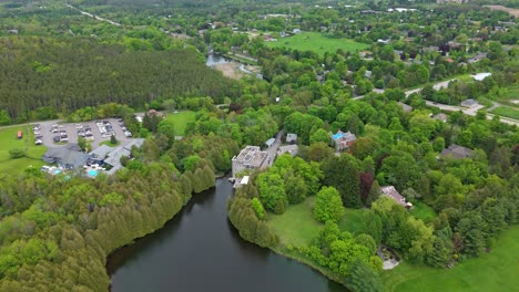 aerial establishing of millcroft inn and spa nestled in a lush green forested area in caledon, ontario