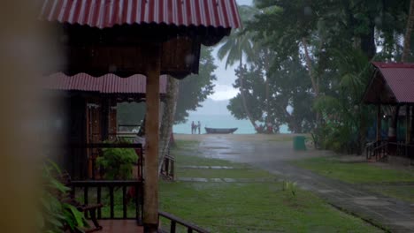 family enjoying a rainy day at the beach