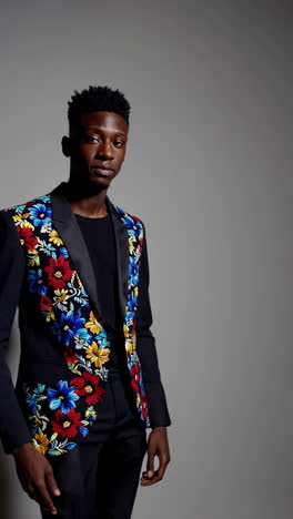 man in a floral embroidered blazer