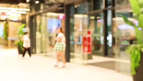 people entering and exiting a shopping mall