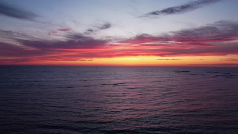 pastel horizon: pink sky over ocean after sundown in enchanting stock footage