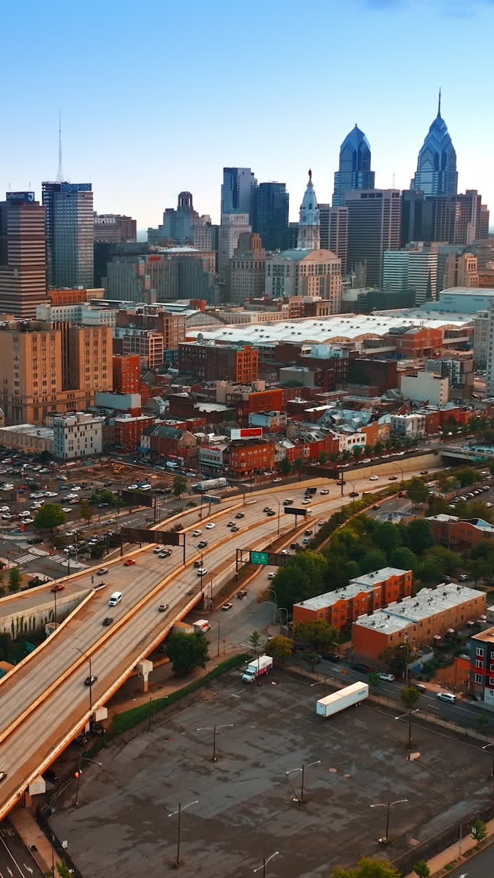 Various cityscape of Philadelphia at sunset. Footage above the highways with cars moving by. Top view. Vertical video