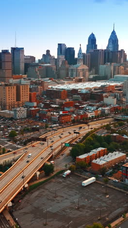 various cityscape of philadelphia at sunset. footage above the highways with cars moving by. top view. vertical video