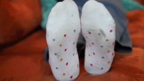 closeup of a pair of white socks with colorful spots