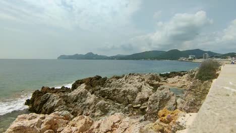 Coast-of-Cala-Ratjada-on-Mallorca-with-bright-rocks-and-an-overcast-sky