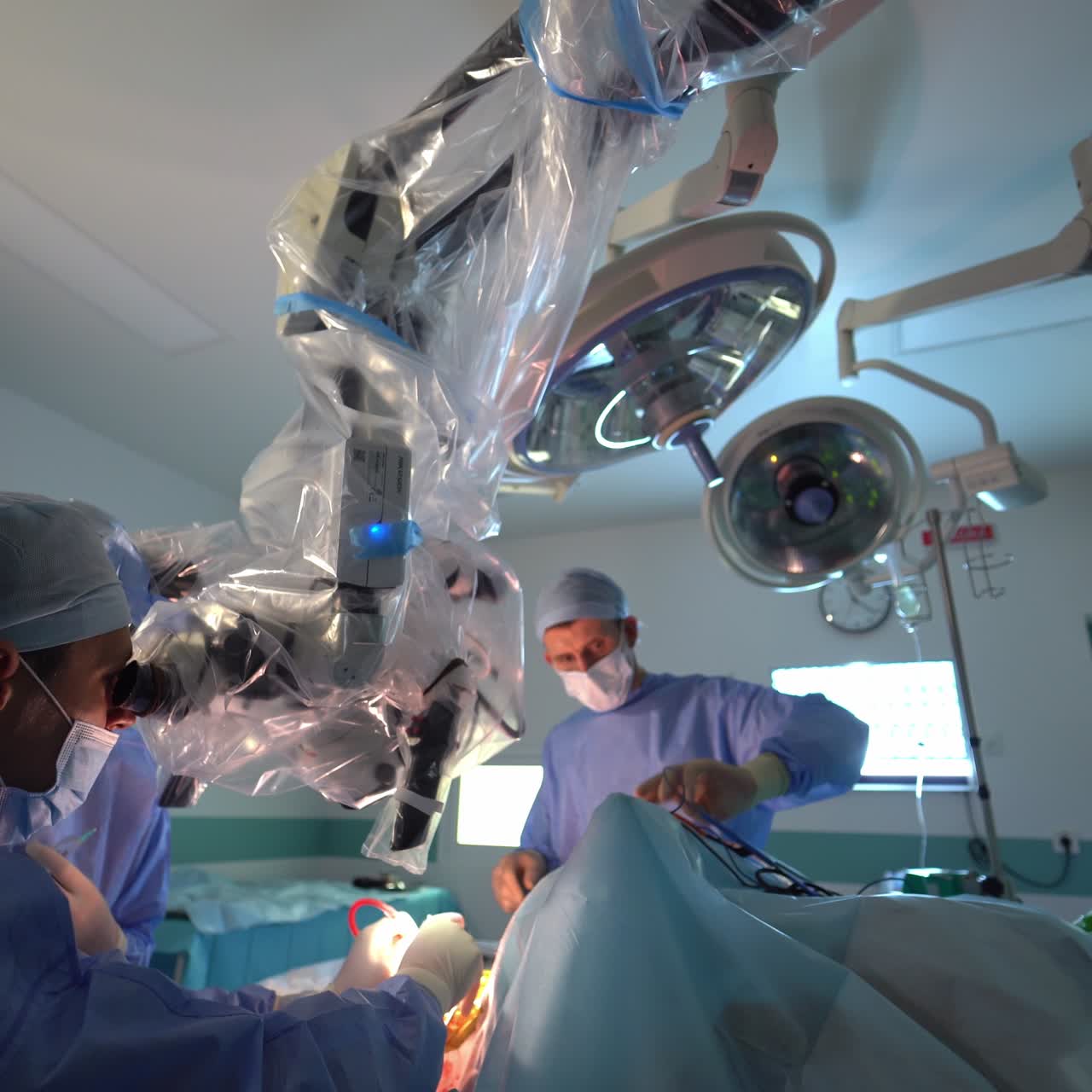 Professional neurosurgery specialist working in emergency room. Operating in modern hospital ward