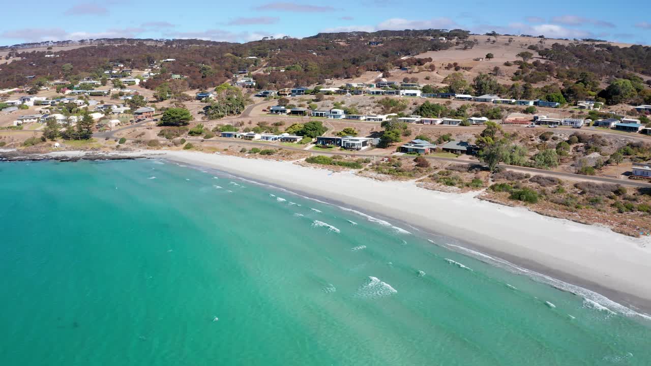 Aerial view of a beach and coastal town