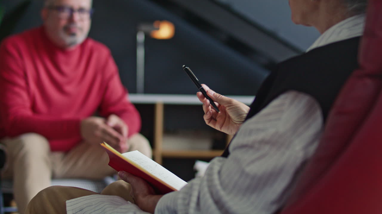 Mid-Aged Man Speaking with Psychologist during Mental Health Consultation