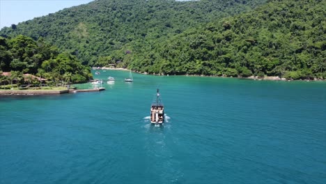 pirate ship tour above crystal clear reef in brazilian ocean sailing between islands