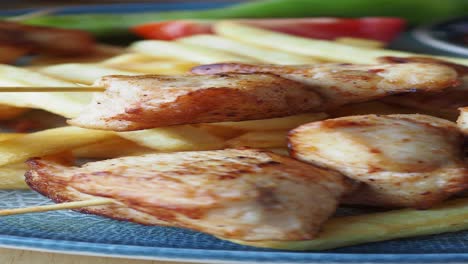 grilled chicken skewers with french fries