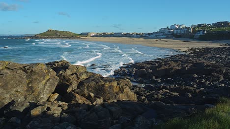 porthmeor beach overlooked by the waterfront homes of st