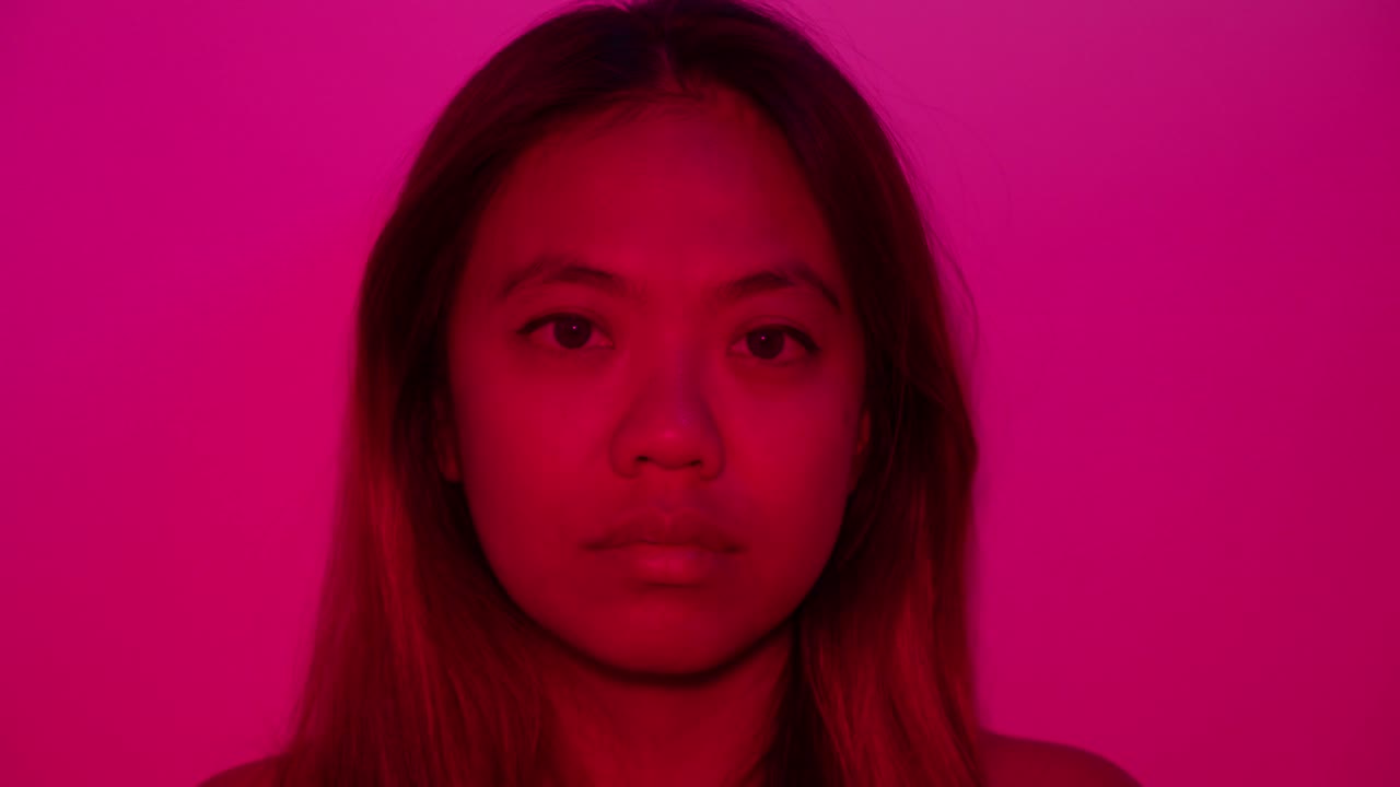 Attractive Asian female Silent expression, abstract vibrant dramatic