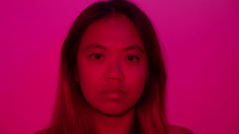 attractive asian female silent expression, abstract vibrant dramatic