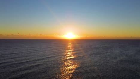 a beautiful sunrise off the coast of south florida in the winter.