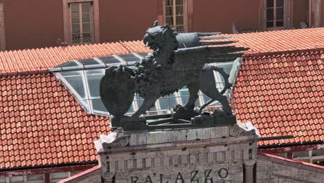 aerial of a statue on top of the prefecture palace in perugia, province of perugia, italy