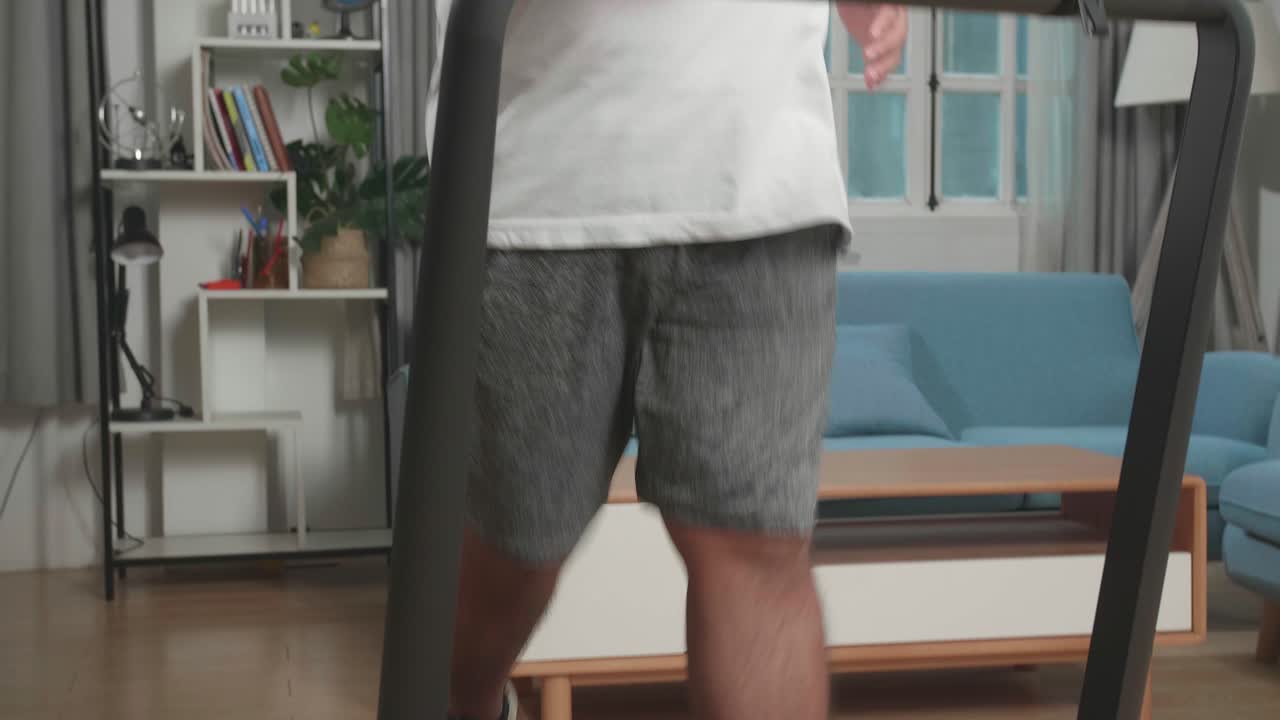 Man Exercising on Treadmill at Home